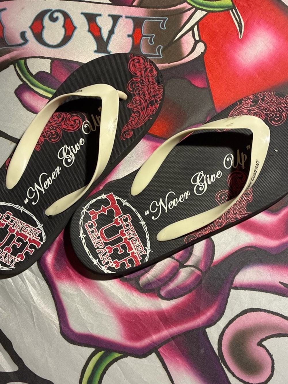 Never Give Up Women's Black Flip Flops with Cream Straps cowgirl tuff company